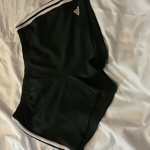 Black with white piping, women's size large, Adidas shorts.